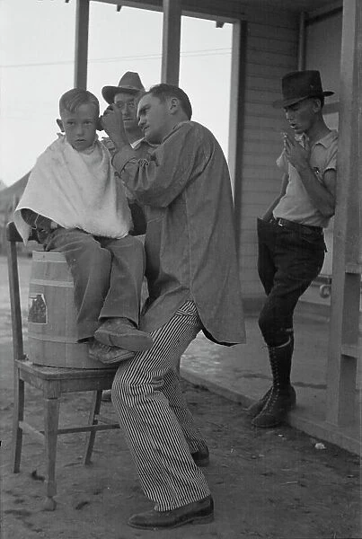 Community barber shop in Kern County migrant camp, California, 1936. Creator: Dorothea Lange