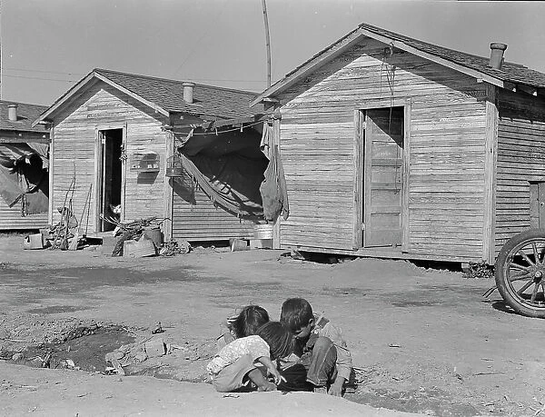 Company housing for cotton workers near Corcoran, California, 1936. Creator: Dorothea Lange