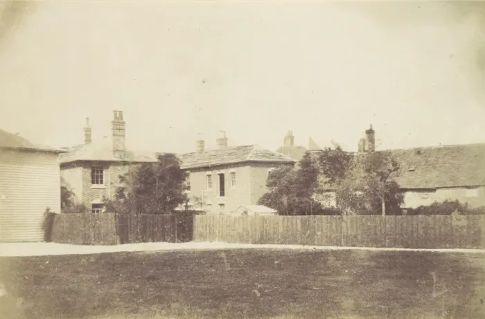 Framed Print : Compound of Buildings Surrounded by Fence, 1850s. Creator: Unknown Framed Print : Compound of Buildings Surrounded by Fence, 1850s. Creator: Unknown