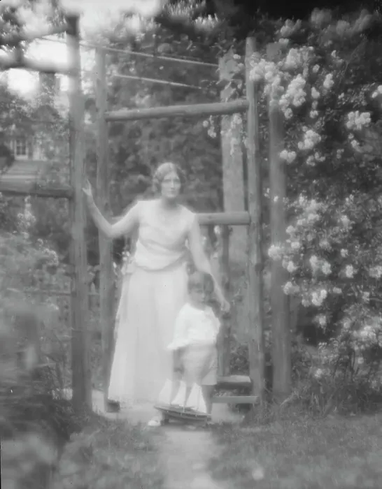 Framed Print : Conroy, Frank, Mrs. and child, standing by a garden gate, 1923 Creator: Arnold Genthe Framed Print : Conroy, Frank, Mrs. and child, standing by a garden gate, 1923 Creator: Arnold Genthe