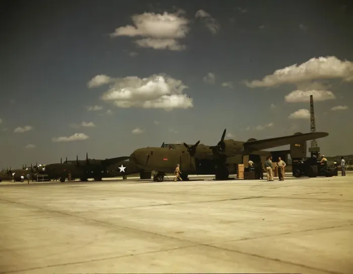 Framed Print : Consolidated transport planes being loaded, Consolidated Aircraft Corp. Fort Worth, Texas, 1942. Creator: Howard Hollem Framed Print : Consolidated transport planes being loaded, Consolidated Aircraft Corp. Fort Worth, Texas, 1942. Creator: Howard Hollem