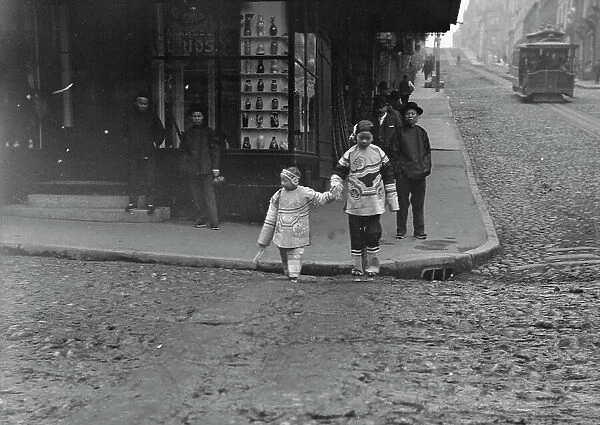 At the corner of Dupont and Jackson Streets, Chinatown, San Francisco, between 1896 and 1906. Creator: Arnold Genthe