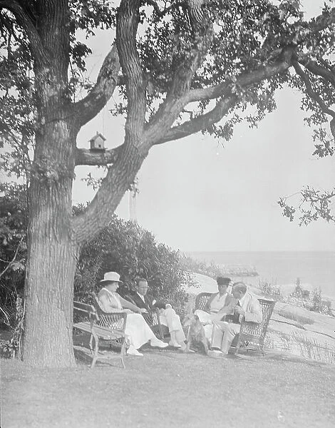 Cosgrave group seated outdoors, 1917 Creator: Arnold Genthe