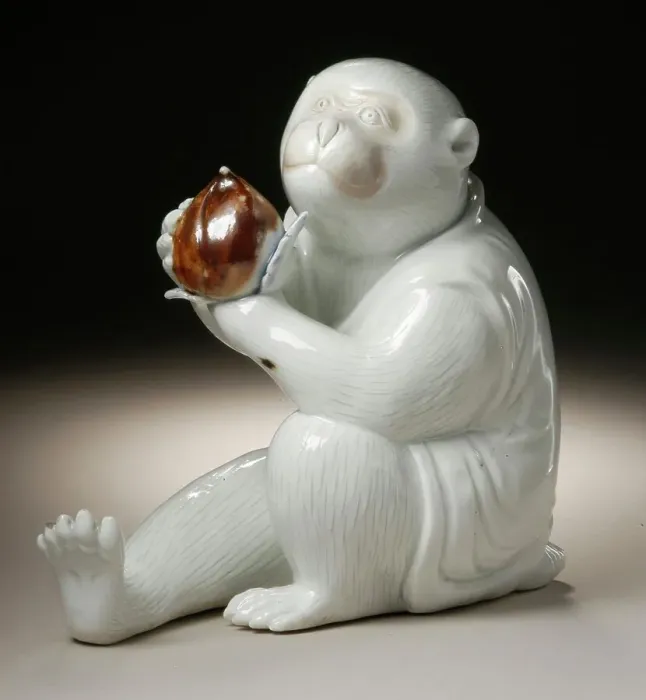 Framed Print : Costumed Monkey Holding a Chestnut, 19th century. Creator: Unknown