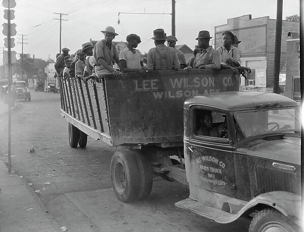 Cotton hoers from Memphis bound for the Wilson Plantation in Arkansas, forty-three miles away, 1937. Creator: Dorothea Lange