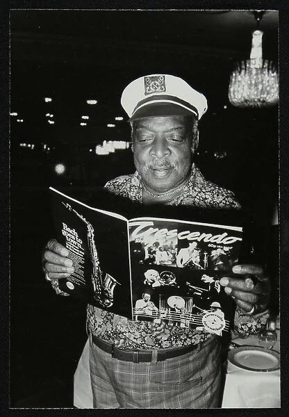 Count Basie reading a copy of Crescendo magazine at the Grosvenor House Hotel, London, 1979