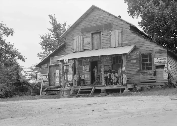 Framed Print : Country store on dirt road, Sunday afternoon, near Gordenton, North Carolina, 1939. Creator: Dorothea Lange
