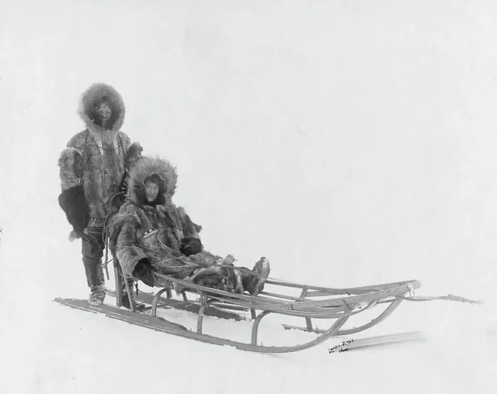 Framed Print : Couple on dog sled, between c1900 and 1927. Creator: Lomen Brothers Framed Print : Couple on dog sled, between c1900 and 1927. Creator: Lomen Brothers