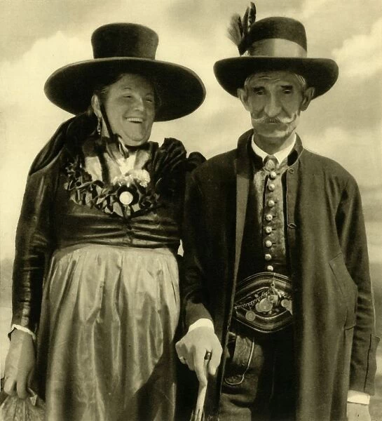 Couple in traditional dress, Sankt Lambrecht, Styria, Austria, c1935. Creator: Unknown