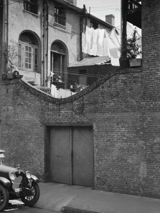 Framed Print : Courtyard with a garage, New Orleans, between 1920 and 1926. Creator: Arnold Genthe Framed Print : Courtyard with a garage, New Orleans, between 1920 and 1926. Creator: Arnold Genthe
