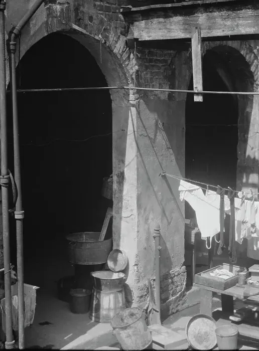 Framed Print : Courtyard with hanging laundry and laundry equipment, New Orleans, between 1920 and 1926. Creator: Arnold Genthe Framed Print : Courtyard with hanging laundry and laundry equipment, New Orleans, between 1920 and 1926. Creator: Arnold Genthe