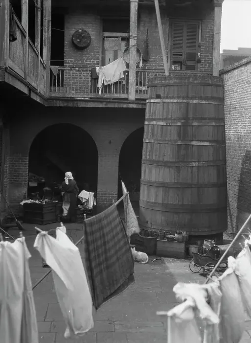 Framed Print : Courtyard with hanging laundry, New Orleans, between 1920 and 1926. Creator: Arnold Genthe Framed Print : Courtyard with hanging laundry, New Orleans, between 1920 and 1926. Creator: Arnold Genthe