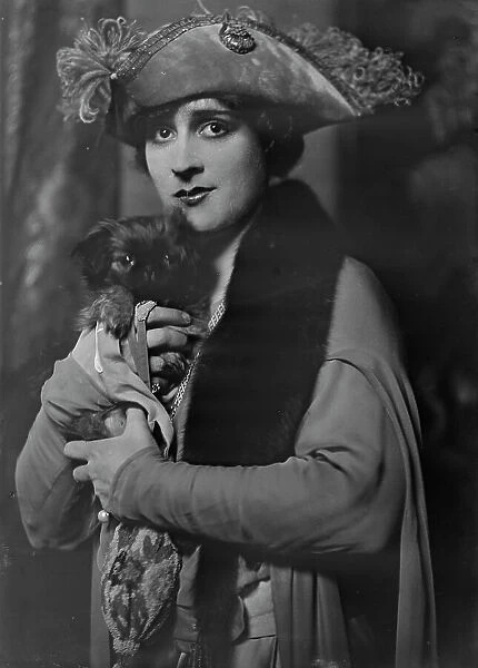 Cowl, Jane, Miss, with dog, portrait photograph, 1918 Oct. 14. Creator: Arnold Genthe