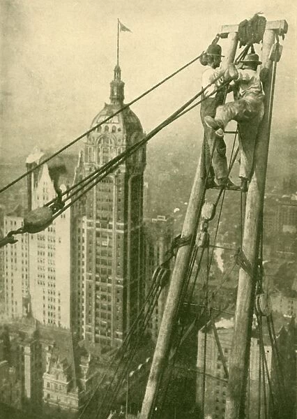 Crane Men at Work on a New York Skyscraper, c1930. Creator: GPA