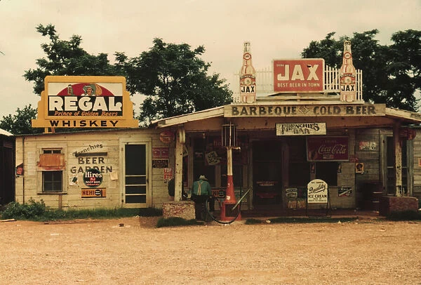 A cross roads store, bar, 'juke joint, 'and gas...in the cotton plantation area, Melrose, La. 1940. Creator: Marion Post Wolcott
