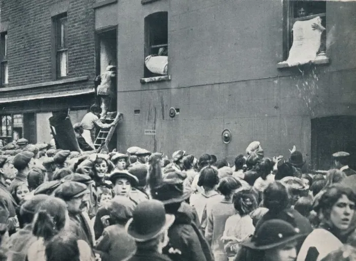 Framed Print : Crowd watching the looting of a German house in Poplar, c1914 Framed Print : Crowd watching the looting of a German house in Poplar, c1914