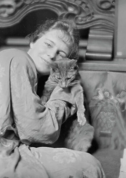 Cutler, Miss, with Buzzer the cat, portrait photograph, 1915 May 26. Creator: Arnold Genthe