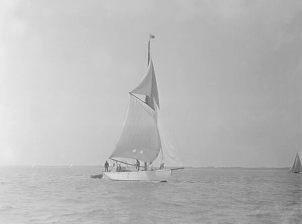 The cutter Mavourneen running downwind, 1922. Creator: Kirk & Sons of Cowes