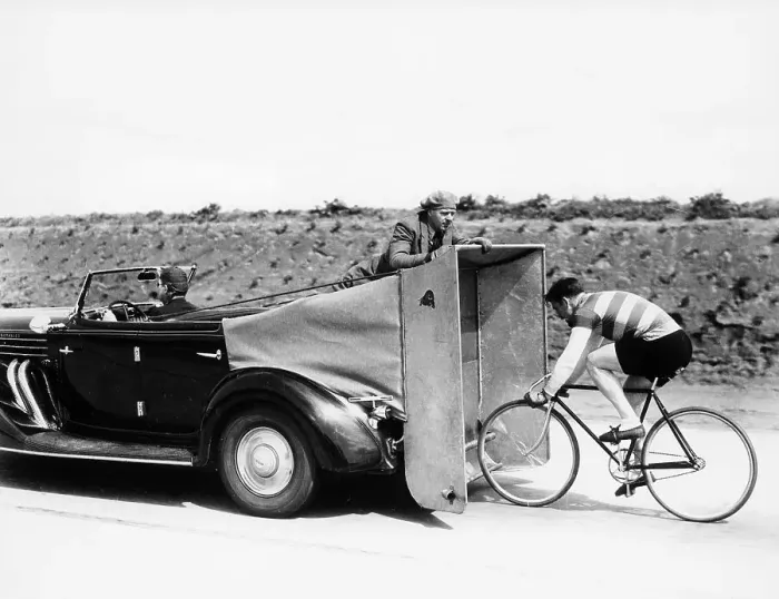 Framed Print : Cyclist training behind an Auburn car, c1935 Framed Print : Cyclist training behind an Auburn car, c1935