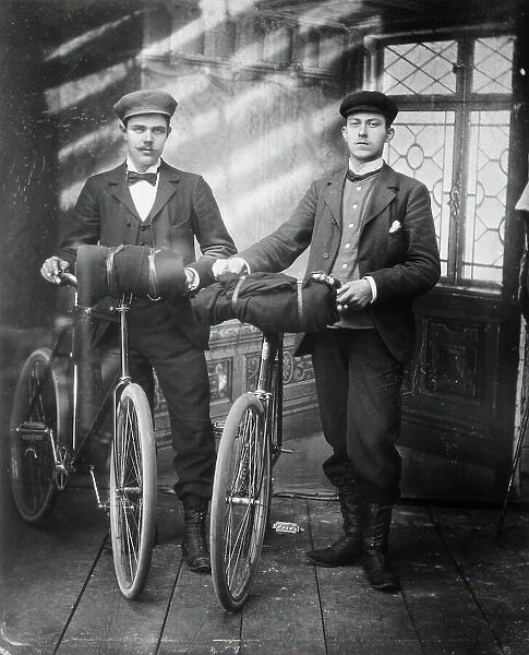 Cyclists in the studio; two men with bicycles, 1890-1910. Creator: Lars Olsson Akerman