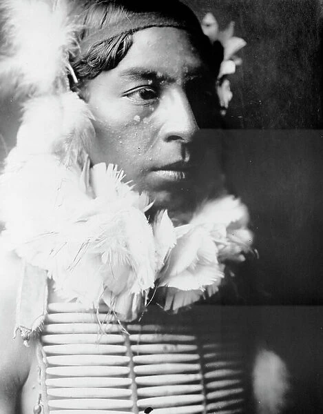 The Dancer, Crow Indian, head-and-shoulders portrait, facing right, c1905. Creator: Edward Sheriff Curtis