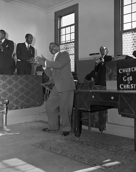 Deacons corner during Sunday morning service at the Church of God in Christ, Washington, DC, 1942. Creator: Gordon Parks