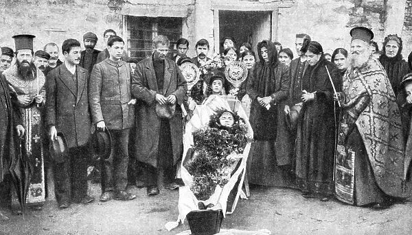 A dead Greek peasant lying in a coffin, 1922.Artist: HA Fawcett