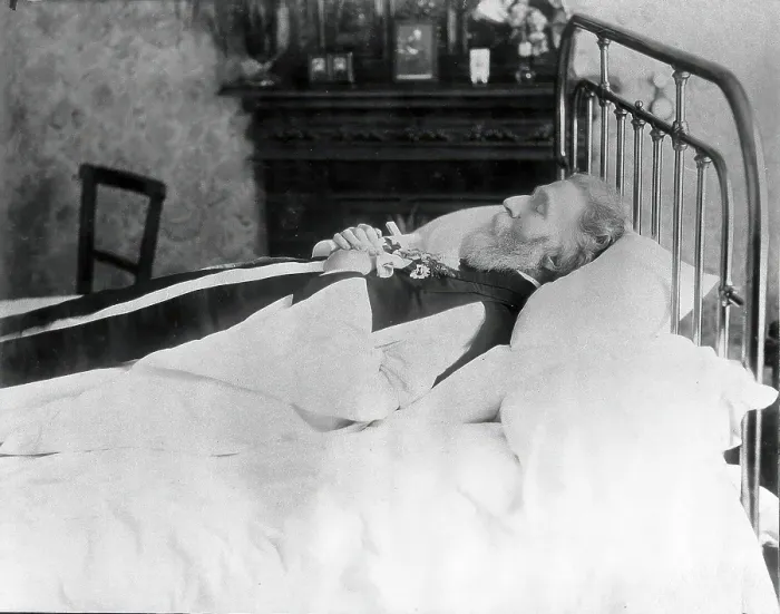 Framed Print : A dead man, wearing robes, lying on his deathbed, (1900?). Creator: Unknown Framed Print : A dead man, wearing robes, lying on his deathbed, (1900?). Creator: Unknown