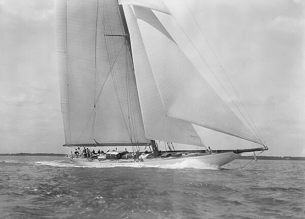 Deck of the 23-metre cutter Astra sailing close-hauled, 1933. Creator: Kirk & Sons of Cowes