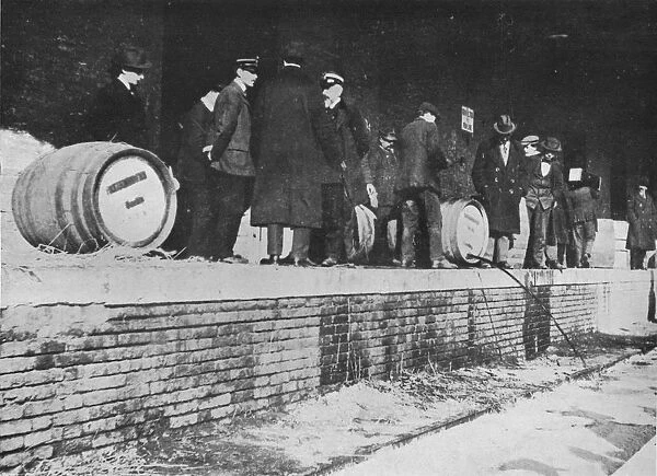 After the Declaration of War: German beer being run away at an Italian Customs store, 1915