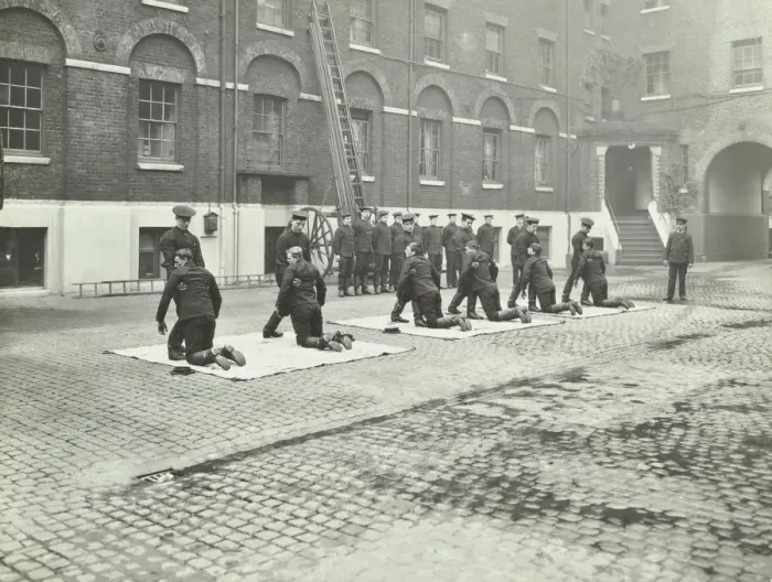 Framed Print : Demonstrating how to pick up an unconscious person, London Fire Brigade Headquarters, London, 1910 Framed Print : Demonstrating how to pick up an unconscious person, London Fire Brigade Headquarters, London, 1910
