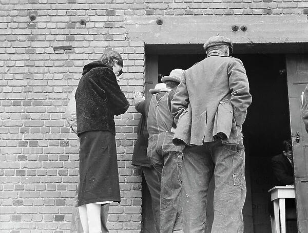 Destitute farm labor families come to FSA distributing depot... Kern County, California, 1938. Creator: Dorothea Lange