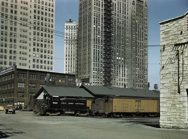 Diesel switch engine moving freight cars... South Water street... Illinois Central R.R. Chicago, 1943 Creator: Jack Delano