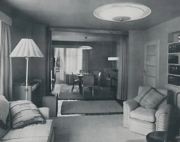 Framed Print : Dining and living room, divided only by heavy curtains in an attractive modern weave, 1942 Framed Print : Dining and living room, divided only by heavy curtains in an attractive modern weave, 1942