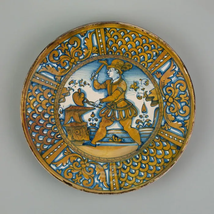 Framed Print : Display Plate with a Man Striking a Heart on an Anvil, Deruta, c. 1550. Creator: Unknown Framed Print : Display Plate with a Man Striking a Heart on an Anvil, Deruta, c. 1550. Creator: Unknown