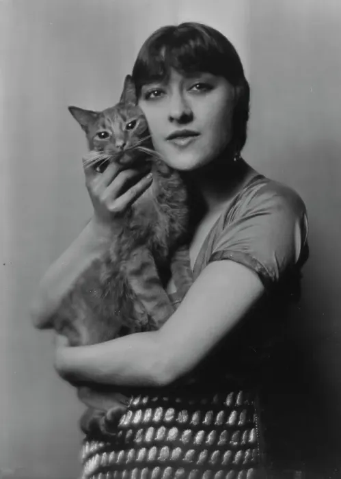 Framed Print : Dolly sister, with Buzzer the cat, portrait photograph, 1916. Creator: Arnold Genthe