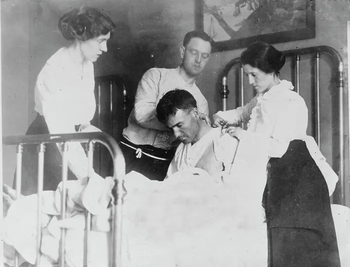 Framed Print : Dr. James F Grant, ship's surgeon, fixing up Gordan G Davidson, survivor of EMPRESS OF... 1914. Creator: Bain News Service Framed Print : Dr. James F Grant, ship's surgeon, fixing up Gordan G Davidson, survivor of EMPRESS OF... 1914. Creator: Bain News Service