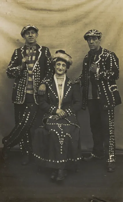 Framed Print : A drag pearly queen and her two kings pose for a group portrait, (between 1910 and 1919?). Creator: Unknown Framed Print : A drag pearly queen and her two kings pose for a group portrait, (between 1910 and 1919?). Creator: Unknown