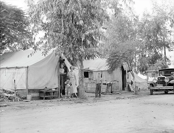 Drought refugees from Oklahoma in cotton camp near Exeter, California, 1936. Creator: Dorothea Lange