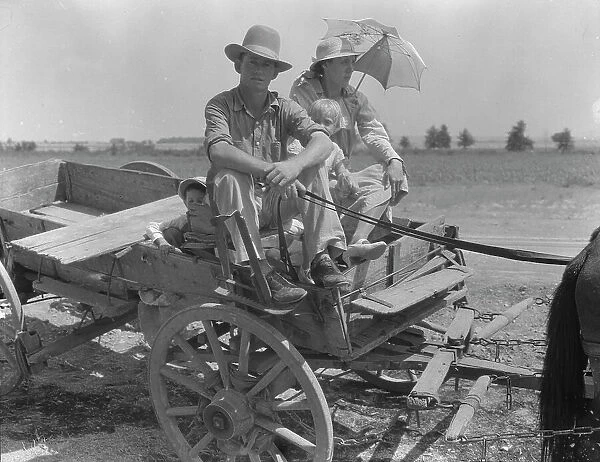 Drought-stricken farmer and family near Muskogee, Oklahoma, 1939. Creator: Dorothea Lange