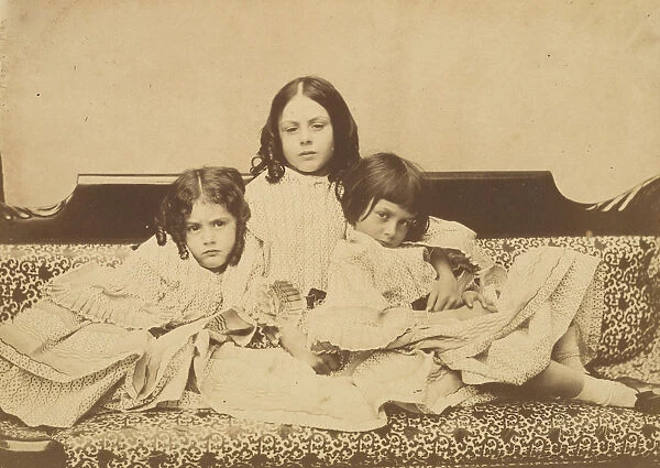 Edith, Ina and Alice Liddell on a Sofa, Summer 1858. Creator: Lewis Carroll