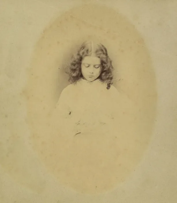 Framed Print : Edith Liddell Seated Beside a Vase of Foxgloves, 1860. Creator: Lewis Carroll