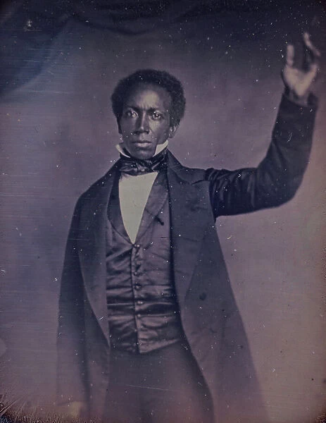 Edward J. Roye, three-quarter length portrait, standing, with hand raised, between 1856 and 1858. Creator: Augustus Washington
