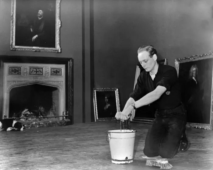 Framed Print : Edward, Lord Montagu of Beaulieu scrubbing floors in Palace House 1952. Creator: Unknown