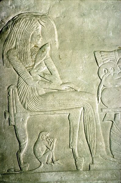 Egyptian Relief. Seated Lady with elaborate hairstyle