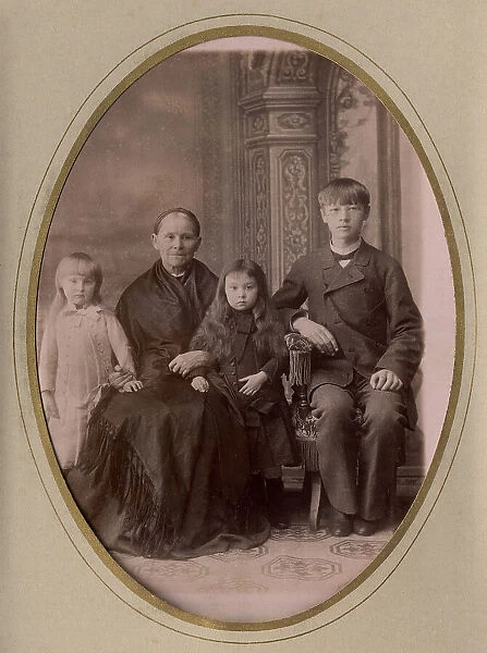 An elderly woman, a young man in a civilian suit and two. late 19th cent - early 20th cent. Creator: PA Milevskii