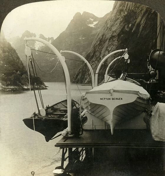 En route to North Cape-skirting precioitous cliffs along Lyngenfjord, Norway, c1905