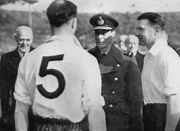 English footballer Eddie Hapgood meeting King George VI, c1937-c1944