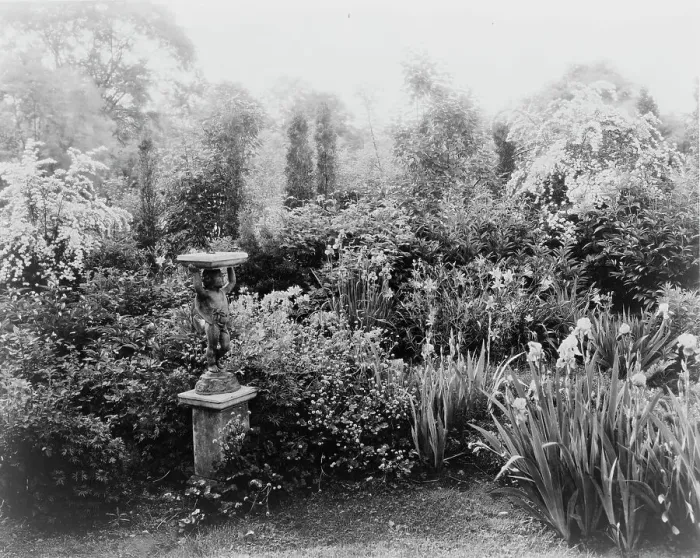 Framed Print : English lead figurine holding sundial, Graham Nichols garden, Greenwich, Connecticut, c1908 - 1927. Creator: Frances Benjamin Johnston Framed Print : English lead figurine holding sundial, Graham Nichols garden, Greenwich, Connecticut, c1908 - 1927. Creator: Frances Benjamin Johnston