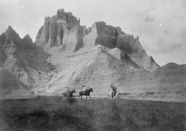 Entering the Bad Lands. Three Sioux Indians on horseback, c1905. Creator: Edward Sheriff Curtis